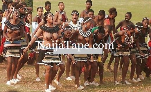 African Girl Displaying Breast During Festival